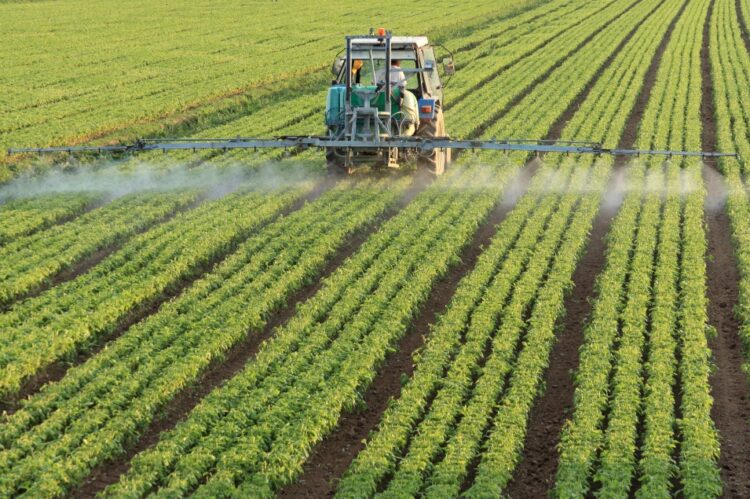 spraying a field