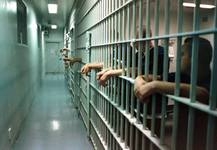 PHOTO BY ROD BOAM---Inmates stand in their cells at the Cache County Jail Wednesday  Nov. 14, 2001. The Jail is filled to capacity forcing Cache County officials to transport prisoners to other jails in Weber and Box Elder County.